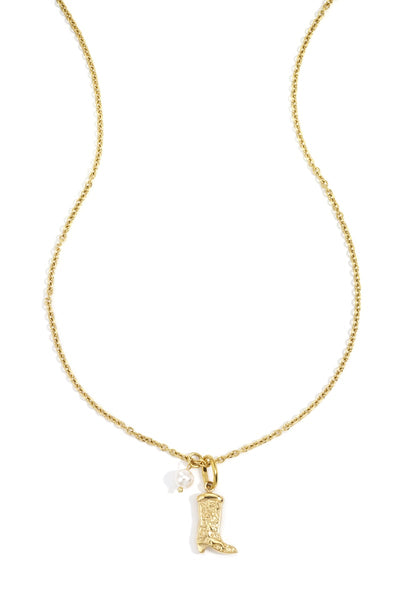 close-up of boot pendant necklace detail