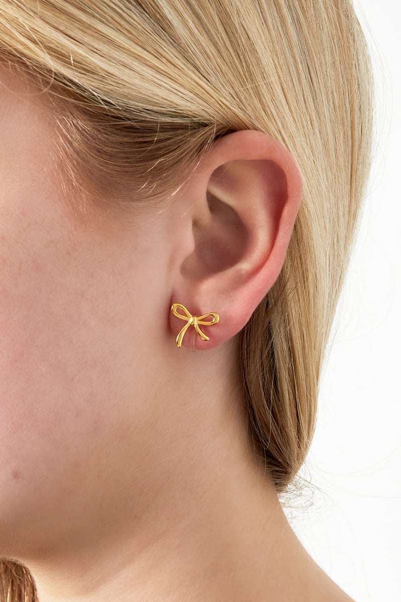bow clip earrings worn on ear