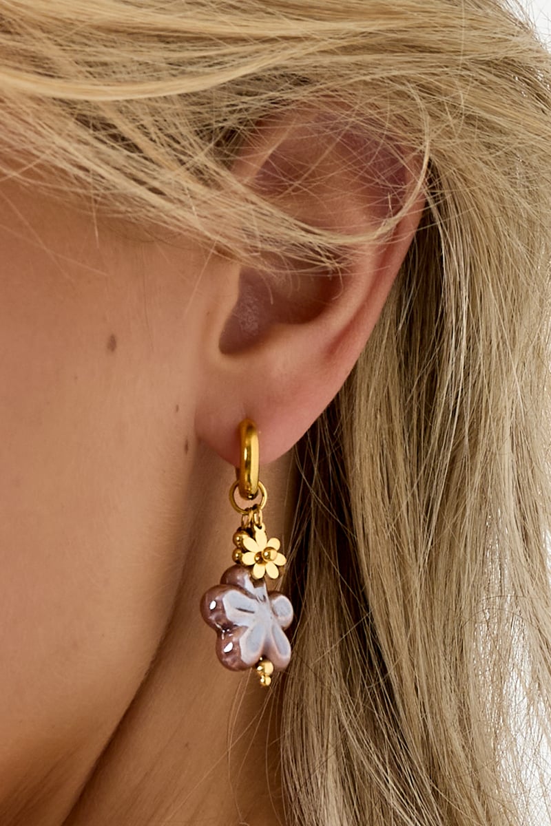 close-up of flower drop earrings detail