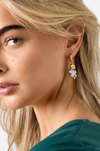 flower drop earrings worn on ear