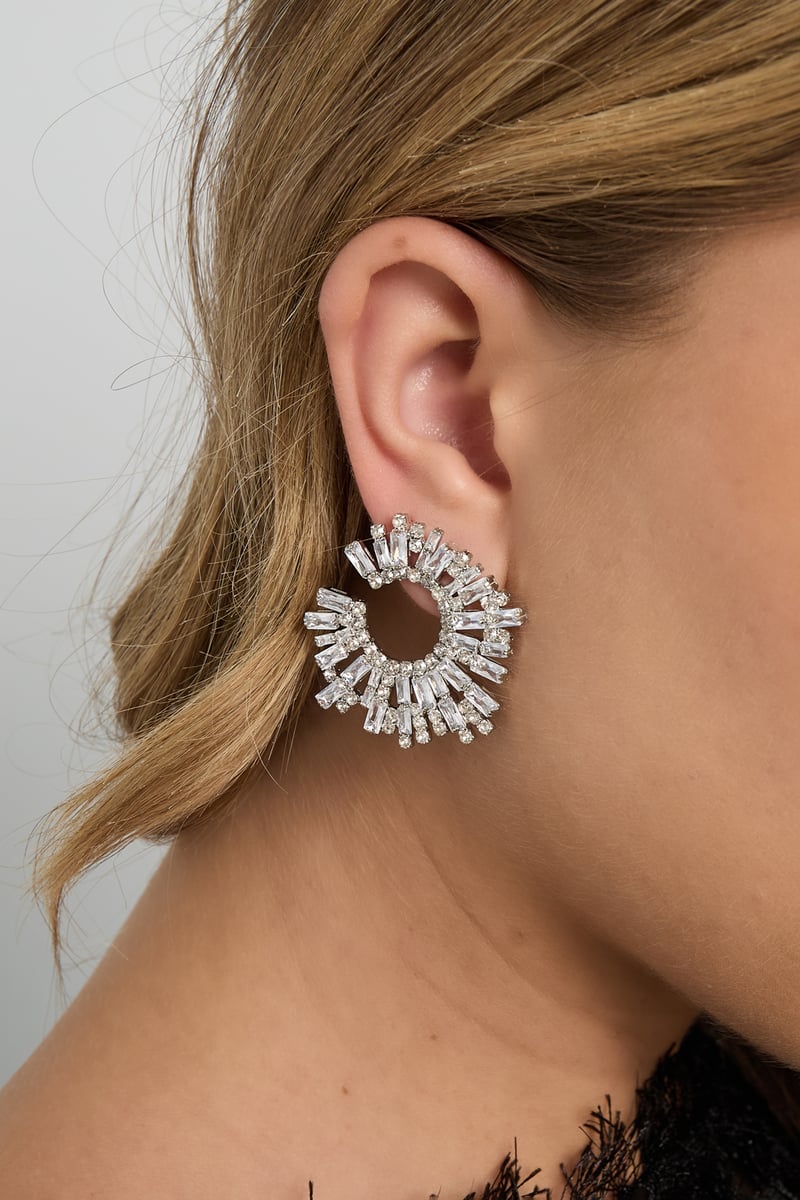 close-up of geometric copper stud earrings