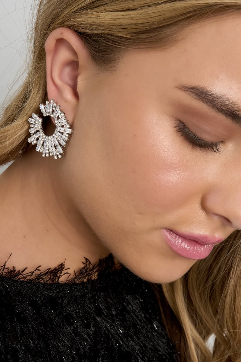 geometric copper stud earrings worn on ear