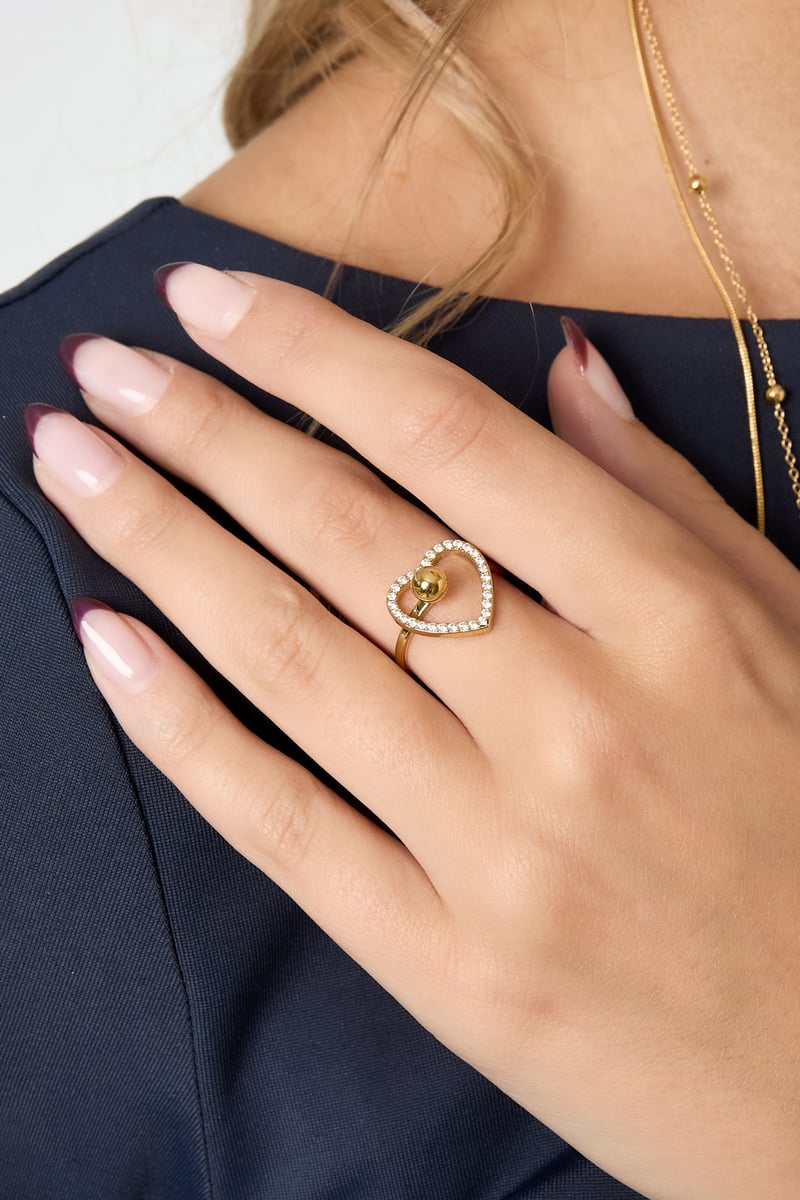 heart statement ring worn on finger